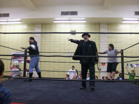 Mr. WOOD talking while BIG RON loosens up.