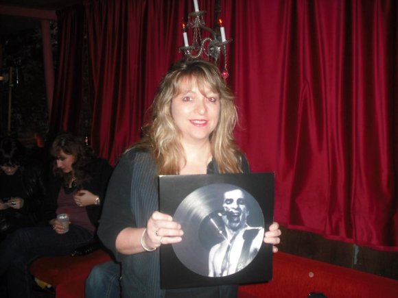 KAT holding one of the limited edition picture vinyl by THE UNDEAD.