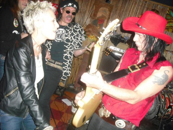 JANIS dances in GASS' face while ANDROID watches from beyond.