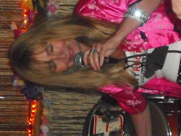 JOY listening to WILD BILL's guitar.
