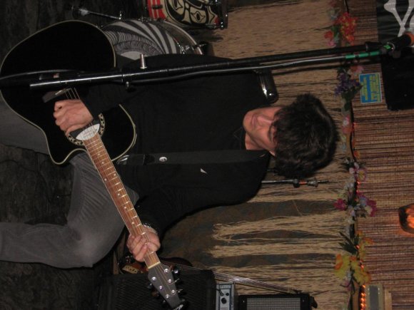 GEORGE plays guitar.