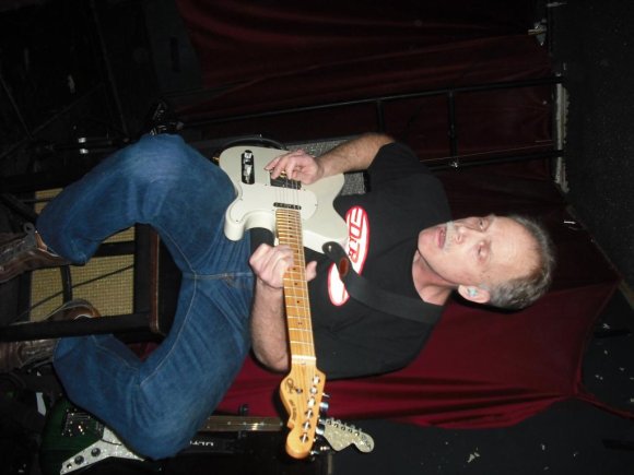 The MAD DOG sits and plays.
