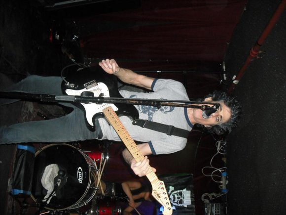 BOBBY STEELE is almost blocked by the mic stand.