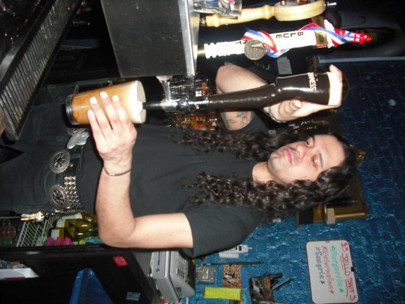 Bartender CHRIS shows how to pour a pint.