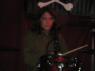 MEGHAN playing the drums.