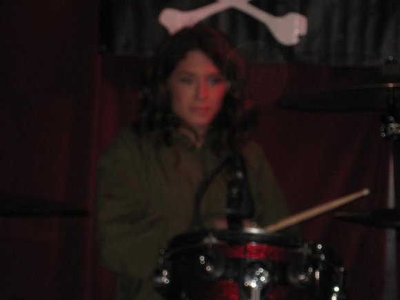 MEGHAN playing the drums.