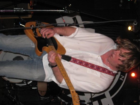 KURT plays the guitar.