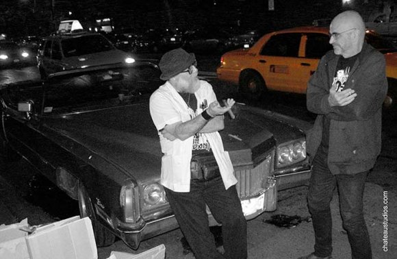 Mr. WOOD and LUNDO talk in front of LUNDO's '72 Cadillac Eldorado convertible.