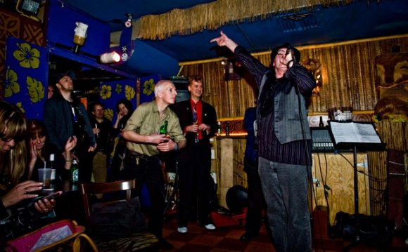 BOB dances as KREBS lays back behind him.