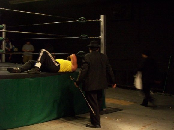 Mr. WOOD helping TIBERIUS out of the ring.