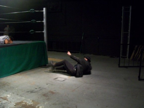 Mr. WOOD knocked off the ring apron.
