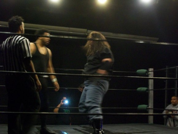 MUTTON and BIG RON eyeballing each other.