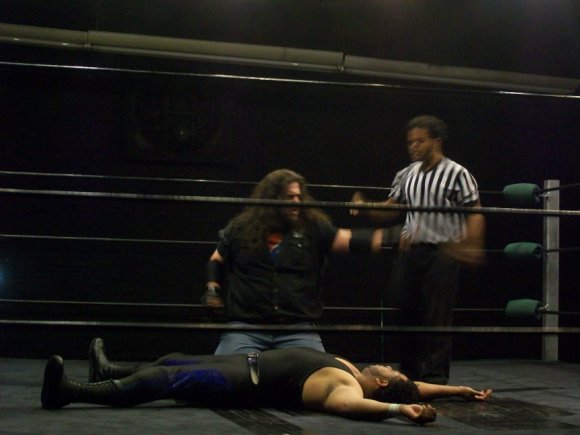BIG RON calling the ref over to count out the bum.
