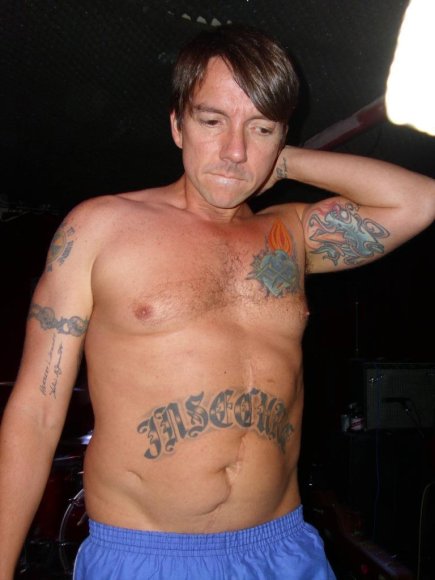 HUEVOS modelling some of his tats!