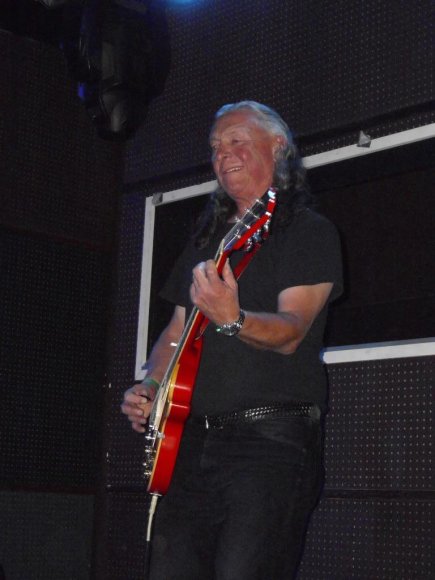 FREDDIE switches to the guitar.
