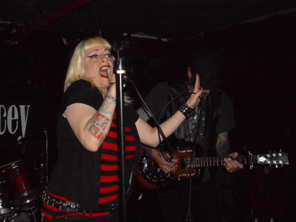 MANDY wails with STURGIS in the shadows.