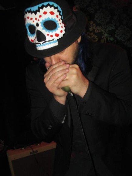 DAVIS blows away on the harmonica!