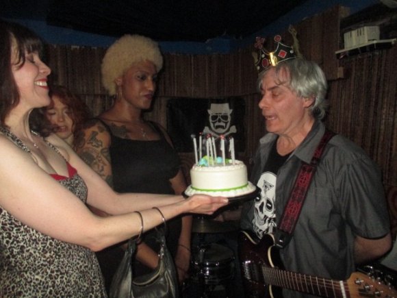 CHRISTA, LAUREN and CYD watch as T. J. blows out the candles!