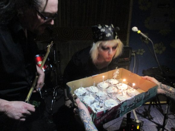 ROB watches as TERESA blows out the candles!