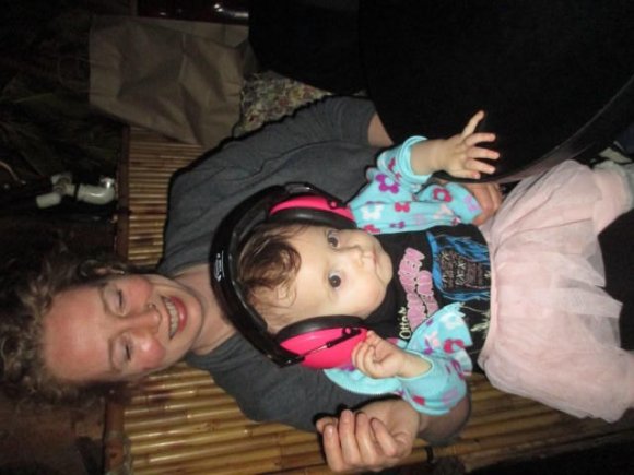VALENTINA is already smarter than most of us with her noise reducing headphones on Momma NELL's lap!